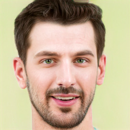 Joyful white young-adult male with short  brown hair and green eyes