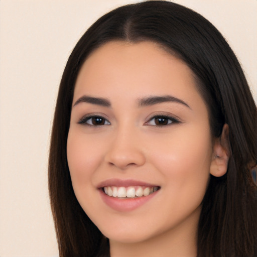 Joyful white young-adult female with long  black hair and brown eyes