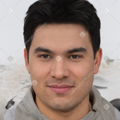 Joyful asian young-adult male with short  brown hair and brown eyes