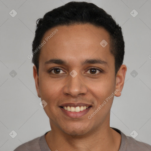 Joyful latino young-adult male with short  black hair and brown eyes