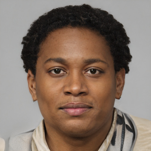 Joyful latino young-adult male with short  brown hair and brown eyes