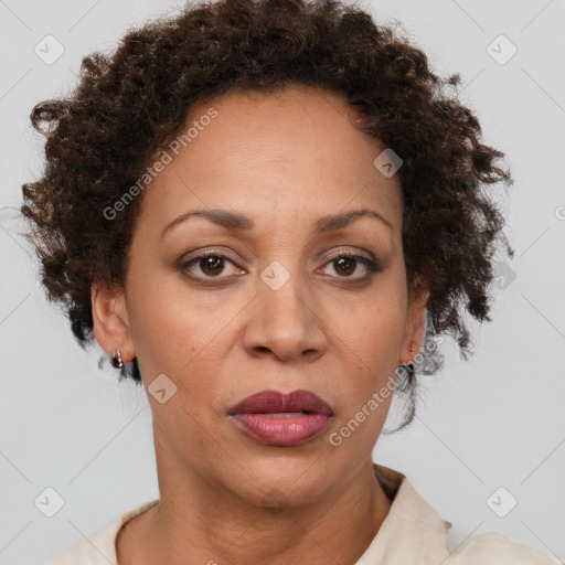 Joyful black adult female with short  brown hair and brown eyes