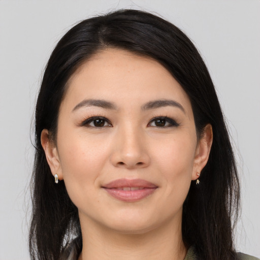 Joyful white young-adult female with long  black hair and brown eyes