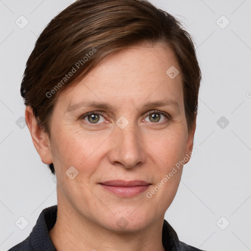 Joyful white adult female with short  brown hair and grey eyes