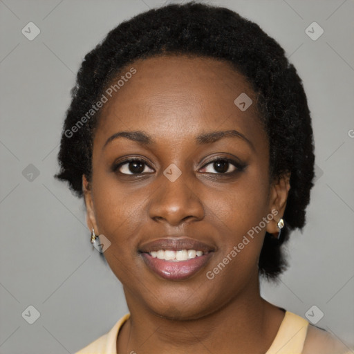 Joyful black young-adult female with short  black hair and brown eyes