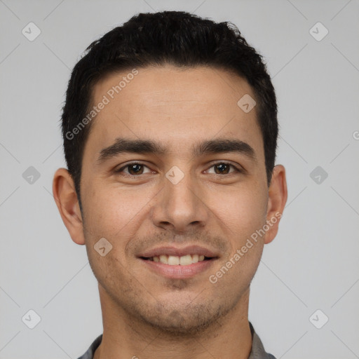 Joyful white young-adult male with short  black hair and brown eyes