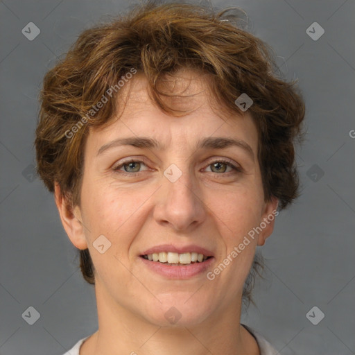 Joyful white adult female with short  brown hair and brown eyes