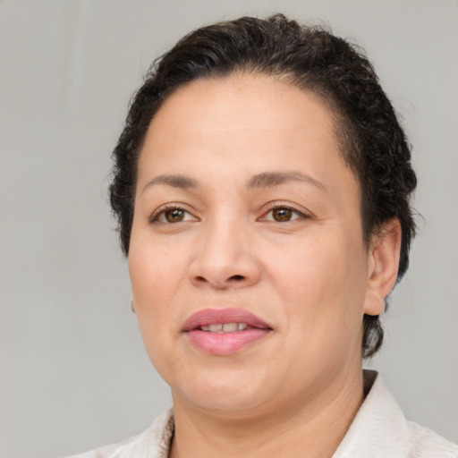 Joyful white adult female with short  brown hair and brown eyes