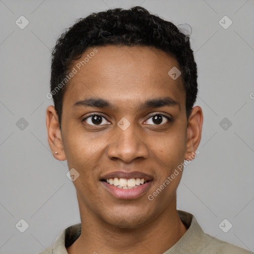 Joyful black young-adult male with short  black hair and brown eyes