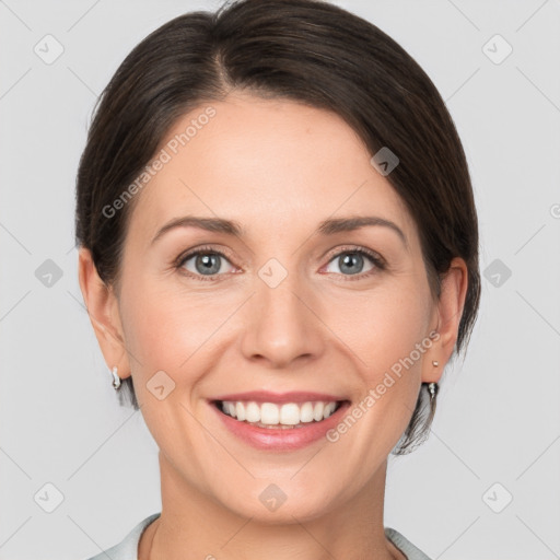 Joyful white young-adult female with medium  brown hair and grey eyes