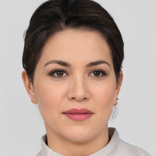 Joyful asian young-adult female with short  brown hair and brown eyes