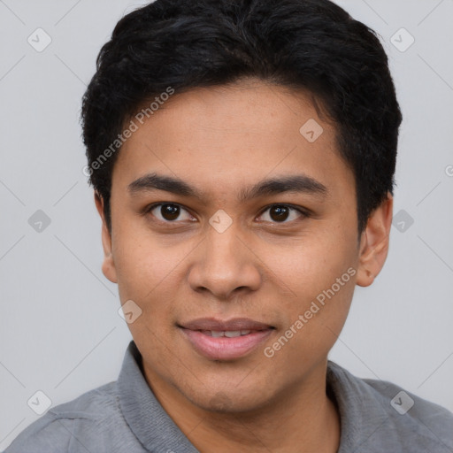 Joyful latino young-adult male with short  brown hair and brown eyes