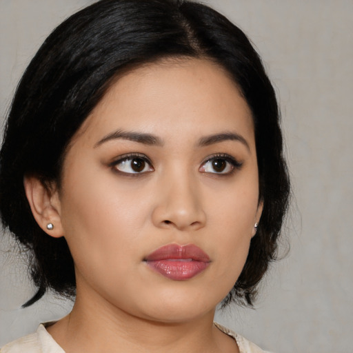 Neutral asian young-adult female with medium  black hair and brown eyes