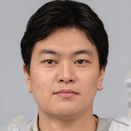 Neutral asian young-adult male with short  brown hair and brown eyes