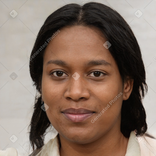 Joyful black young-adult female with medium  brown hair and brown eyes