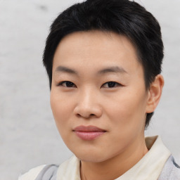 Joyful asian young-adult female with short  black hair and brown eyes