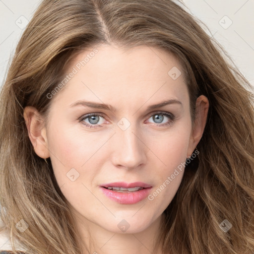 Joyful white young-adult female with long  brown hair and blue eyes