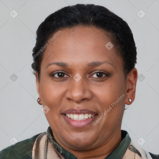 Joyful latino adult female with short  brown hair and brown eyes