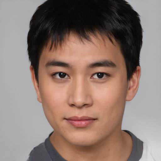 Neutral asian young-adult male with short  brown hair and brown eyes