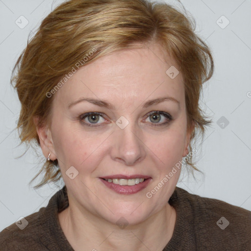 Joyful white adult female with medium  brown hair and blue eyes