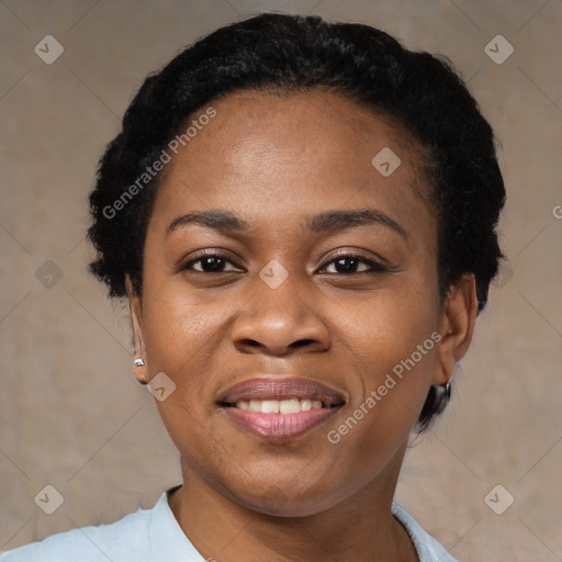 Joyful black young-adult female with short  black hair and brown eyes