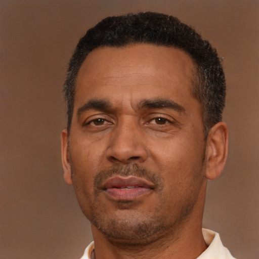 Neutral latino adult male with short  brown hair and brown eyes