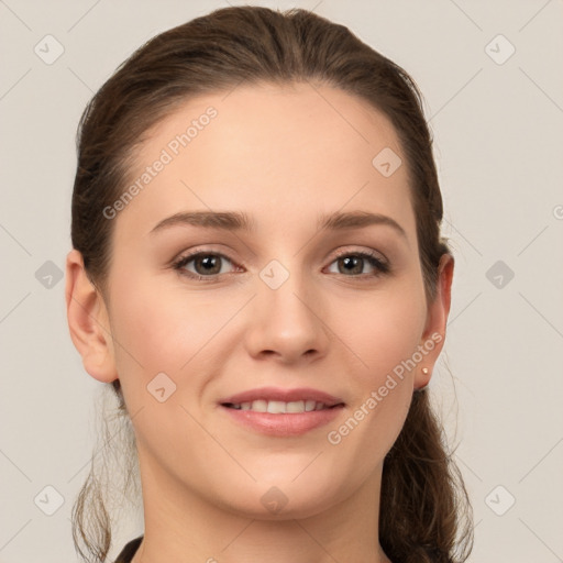 Joyful white young-adult female with long  brown hair and grey eyes