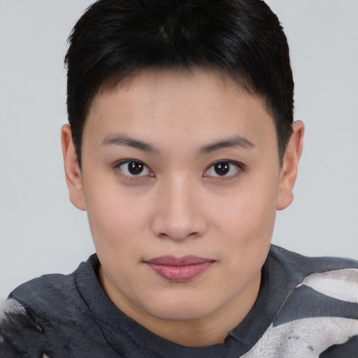 Joyful asian young-adult female with short  brown hair and brown eyes