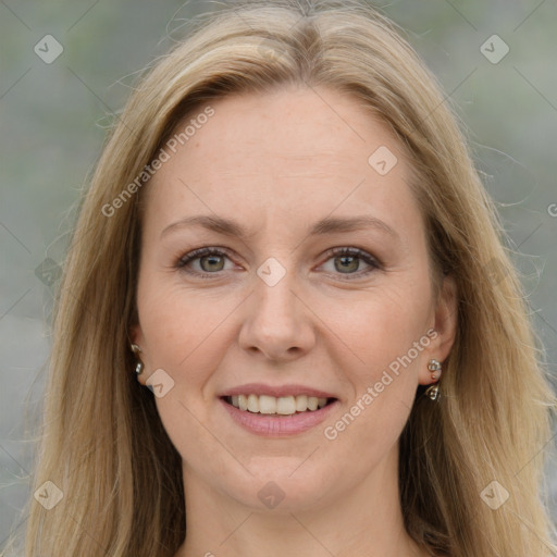 Joyful white adult female with long  brown hair and grey eyes