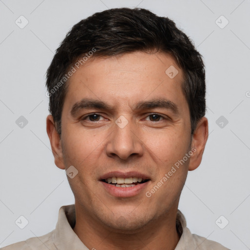 Joyful white young-adult male with short  black hair and brown eyes