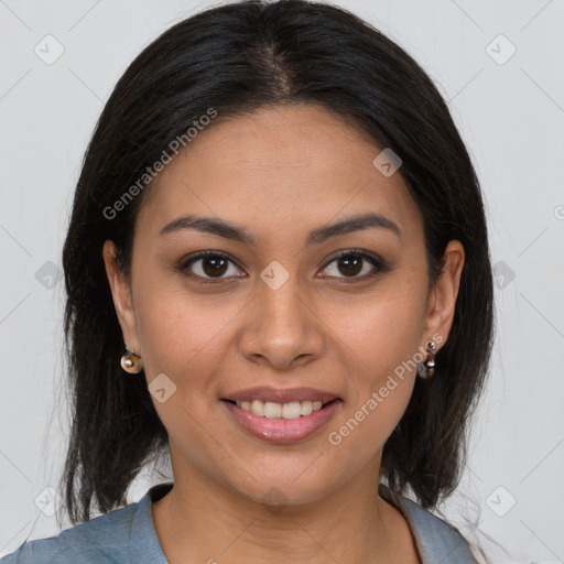 Joyful latino young-adult female with medium  brown hair and brown eyes