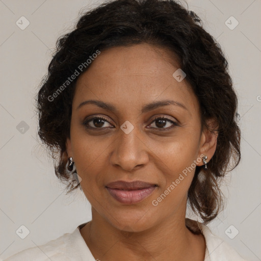 Joyful black young-adult female with medium  brown hair and brown eyes