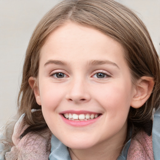 Joyful white child female with medium  brown hair and blue eyes