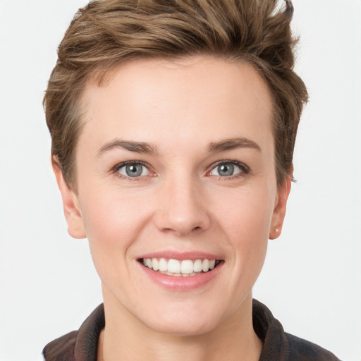 Joyful white young-adult female with short  brown hair and grey eyes