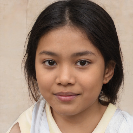 Joyful latino child female with medium  brown hair and brown eyes