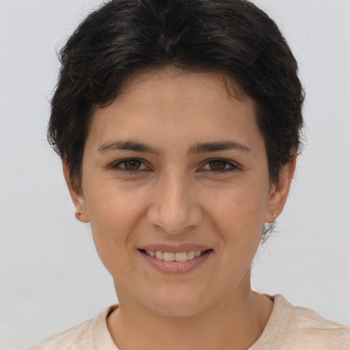 Joyful white young-adult female with short  brown hair and brown eyes