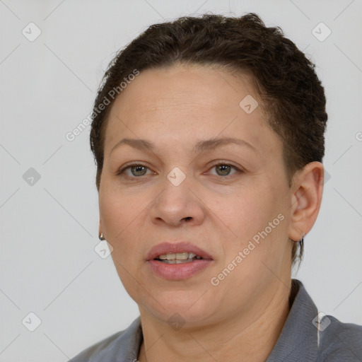 Joyful white adult female with short  brown hair and brown eyes