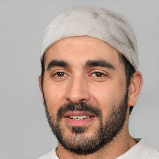 Joyful white young-adult male with short  black hair and brown eyes