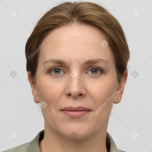 Joyful white adult female with short  brown hair and grey eyes