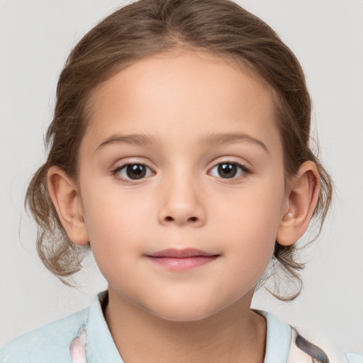 Joyful white child female with medium  brown hair and brown eyes