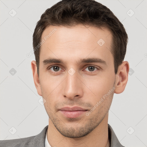 Neutral white young-adult male with short  brown hair and brown eyes