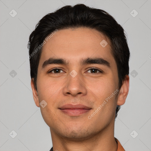 Joyful white young-adult male with short  black hair and brown eyes