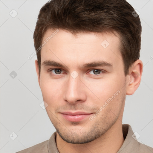 Neutral white young-adult male with short  brown hair and brown eyes