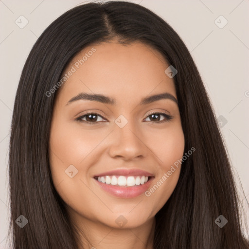 Joyful latino young-adult female with long  brown hair and brown eyes