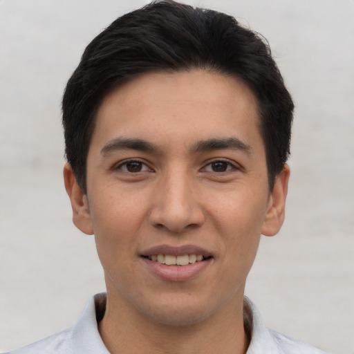 Joyful asian young-adult male with short  black hair and brown eyes