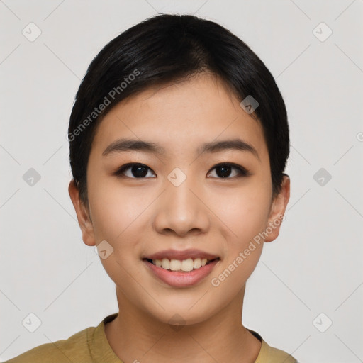 Joyful asian young-adult female with short  black hair and brown eyes