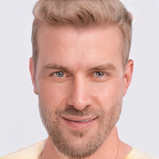 Joyful white adult male with short  brown hair and grey eyes