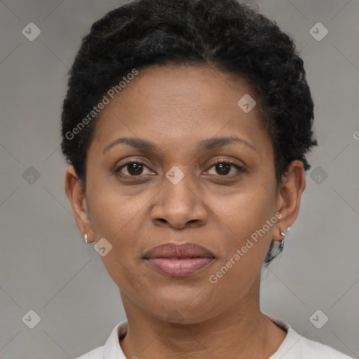 Joyful black adult female with short  brown hair and brown eyes