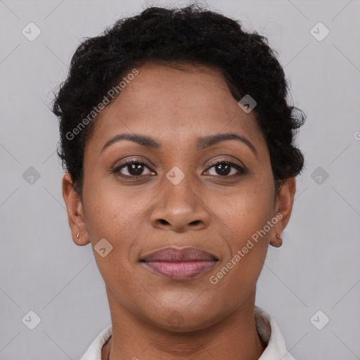 Joyful latino adult female with short  brown hair and brown eyes