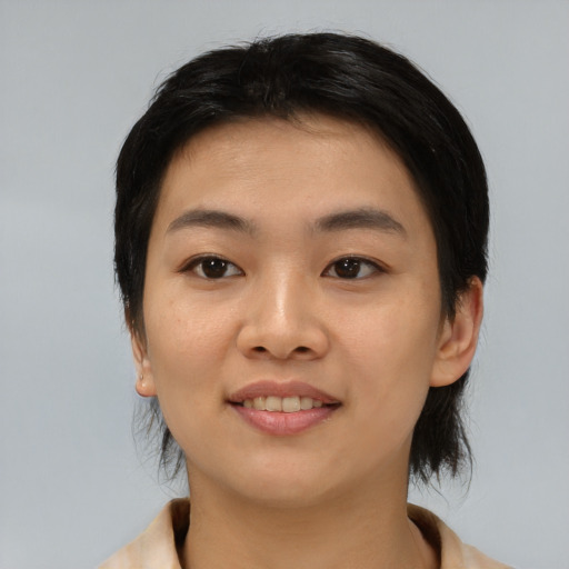 Joyful asian young-adult female with medium  black hair and brown eyes